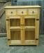 A quirky file cupboard in waxed elm, ring pull handles and butterfly hinges
