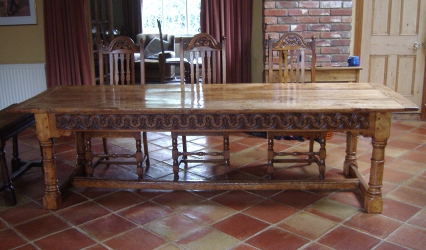 A long table with carved apron.